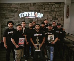 The Stay Sharp crew posing with an award